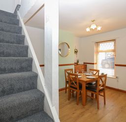 A dining area with table and chairs at Bolton Terrace in Workington
