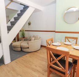 A dining room with a table and chairs at Bolton Terrace in Workington