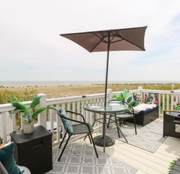 An outdoor seating area with a table and chairs at No. 2 - Seaview Kessingland