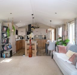 A living room with furniture and kitchen area at No. 2 - Seaview Kessingland