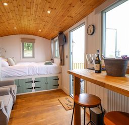 A studio with a bed and seating area at Cheviot in Oswestry