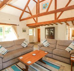 A living room with sofas and a coffee table at Carreg Las in Haverfordwest