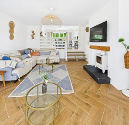 A living room with a sofa and coffee table at 59a Gwscwm Road