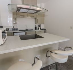 A kitchen with a microwave and stove at Harbour View in Whitehaven