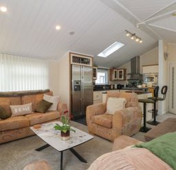 A living room with a sofa and coffee table at Labernum in Lytham St. Annes