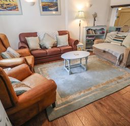 A living room with furniture and decor at Buttercup, Blakeney, Norfolk