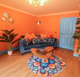 A living room with a blue sofa and a coffee table at Annexe in East End near Brantham