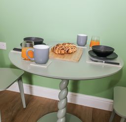 A dining table with croissants and drinks at Annexe, East End near Brantham
