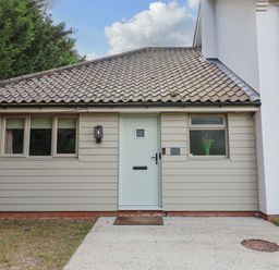 An exterior of a house with a door and windows at Annexe in East End near Brantham
