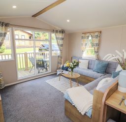 A living room with a sofa and coffee table at Barnes Retreat in Carnforth