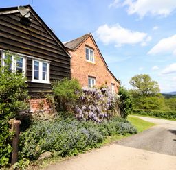 A building with plants and a pathway at Upper Pandy Farm Berriew near Welshpool