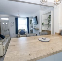 A living room with a sofa and television at Keekle Terrace in Cleator Moor