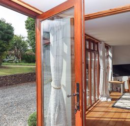 An indoor area featuring a television and seating at Church Barn Sutcombe near Bradworthy