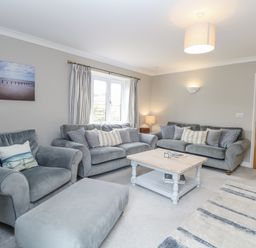 A living room with sofas and a coffee table at Woodlark