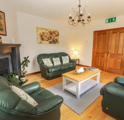 A living room with sofas and a coffee table at Ash House in Ballyvaughan