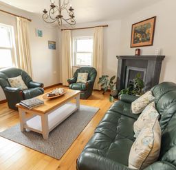 A living room with sofa and armchairs at Ash House in Ballyvaughan