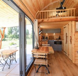 A kitchen with a table and chairs at Bugley Pools Hideaway Bugley near Gillingham