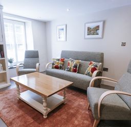 A living room with a sofa and coffee table at Bluck's cottage St. Agnes