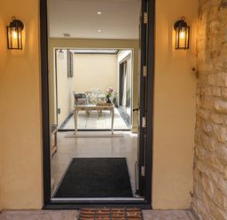 An entrance with a view of a table and chairs at The Annex in Burford