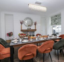 A dining room with a table set for a meal at Aspen Boutique