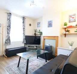 A living room with a sofa and coffee table at Dover Retreat