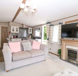 A living room with a sofa and television at 17 Castle Walk Great Yarmouth