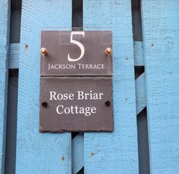 A sign indicating Rose Briar Cottage at 5 Jackson Terrace