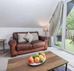 A living room with a sofa and a coffee table at Valley Lodge 20 Callington