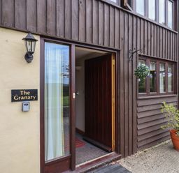 An entrance with a door and windows at The Granary Wyke Nr Axminster