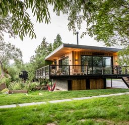 A house with a deck and hammock in the outdoor area at The Red House Farndon