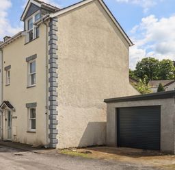 A house with a garage beside it at Swirl Howe in Keswick