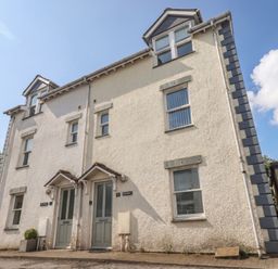 A two-story building exterior with two doors at Swirl Howe in Keswick