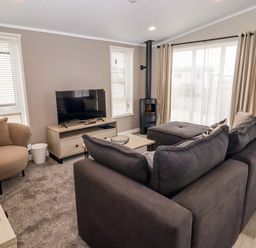 A living room with a sofa and television at Dolphin in Haverfordwest