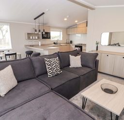 A living room with a sofa and table at Dolphin in Haverfordwest