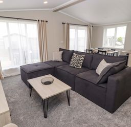 A living room with a sofa and coffee table at Dolphin in Haverfordwest