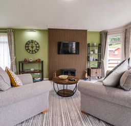 A living room with a sofa and coffee table at Badgers Retreat - Two Dales Richmond