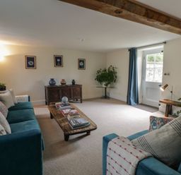 A living room with a sofa and coffee table at West Cottage Myddfai near Llandovery