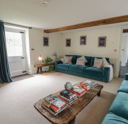A living room with a sofa and coffee table at West Cottage in Myddfai near Llandovery