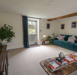 A living room with a sofa and coffee table at West Cottage in Myddfai near Llandovery