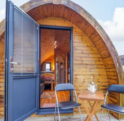 An entrance with chairs and a table at The Pod at Greenbank in Isle of Skye