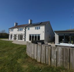 A house with patio and fence at Criw Bryncroes near Sarn Meyllteyrn