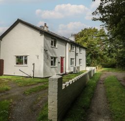 A house with a garden and pathway at Neuadd Wen in Gaerwen