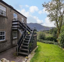 An outdoor view of stairs leading to a building at Buckbarrow in Seascale
