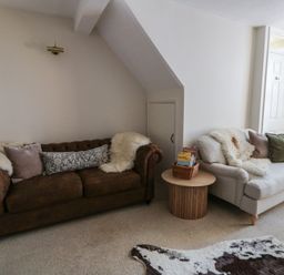 A living room with two couches and a coffee table at Cariad Cottage in Hereford