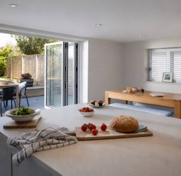 A kitchen with food items and outdoor access at Wood Cottage
