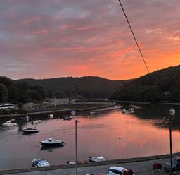 A river with boats during sunset at Overdale in Looe
