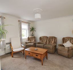 A living room with chairs and a coffee table at Dunbrody Dreams
