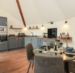 A kitchen with a dining area at Y Cwlwm in Lampeter