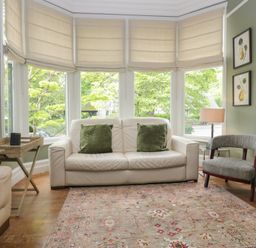 A living room with a sofa and a chair at The Boundary in Windermere