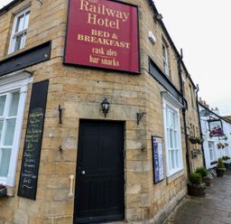 The Railway Hotel sign outside the property at The Railway Apartment in Hexham